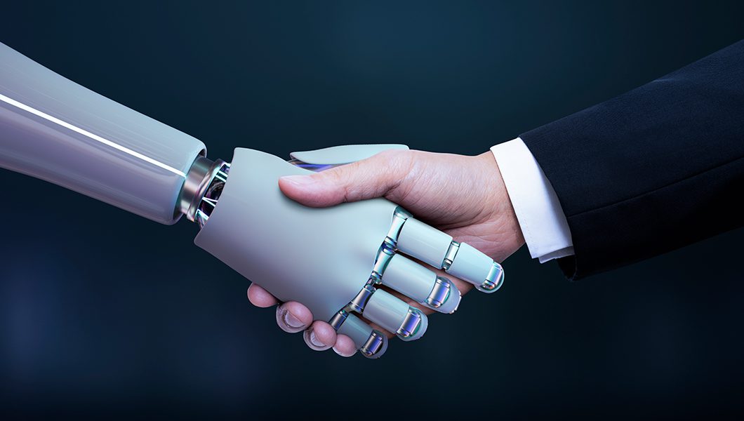 Aperto de mão entre um humano e uma máquina com inteligência artificial